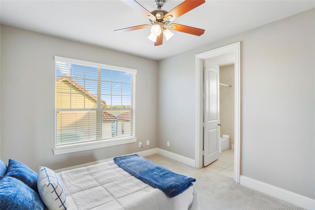 6748 Plaza Via Irving, TX 75039 - Photo 20 of 31 a bedroom with a bed and a window