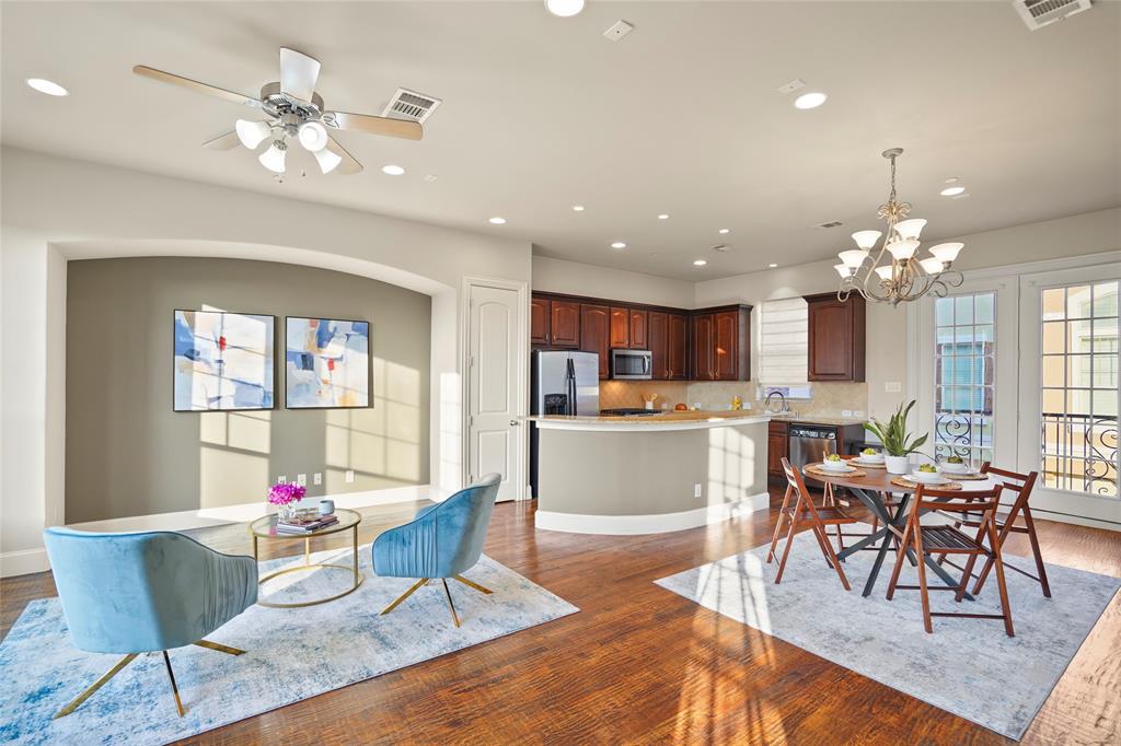6748 Plaza Via Irving, TX 75039 - Photo 3 of 31 a living room with dining room and kitchen view