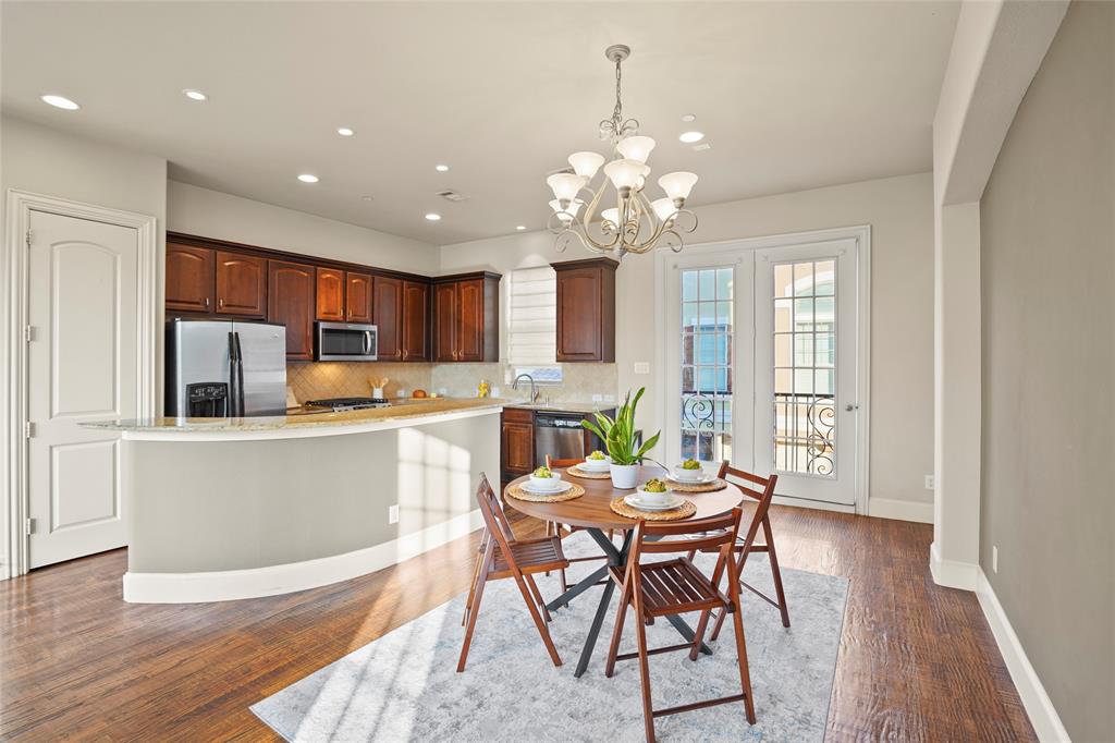6748 Plaza Via Irving, TX 75039 - Photo 5 of 31 a view of a dining room with furniture wooden floor and chandelier