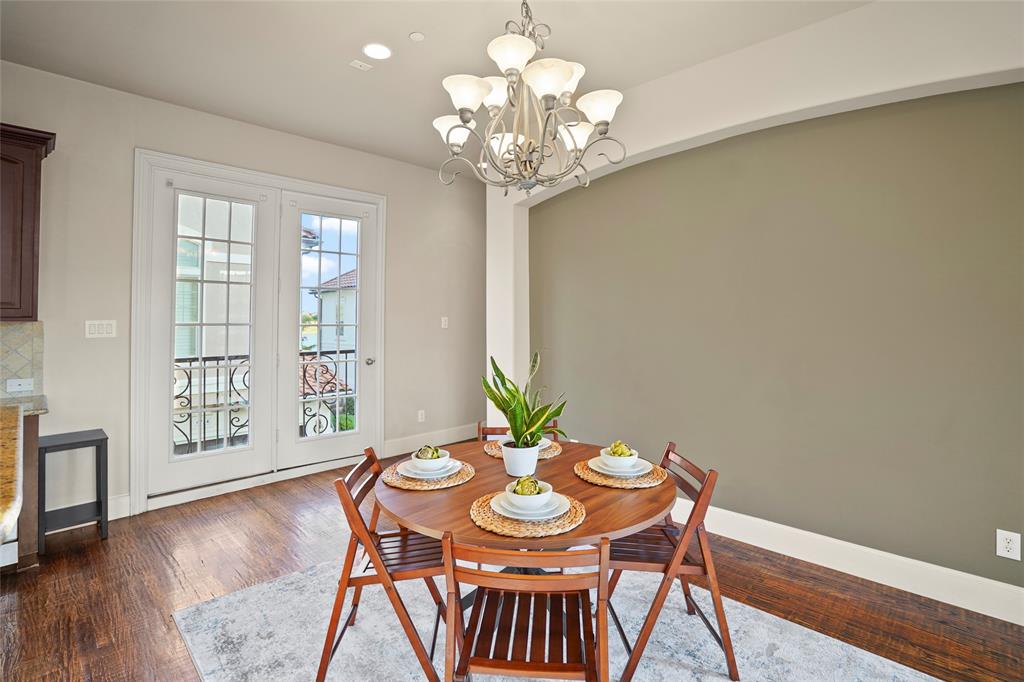 6748 Plaza Via Irving, TX 75039 - Photo 6 of 31 a view of a dining room with furniture and wooden floor