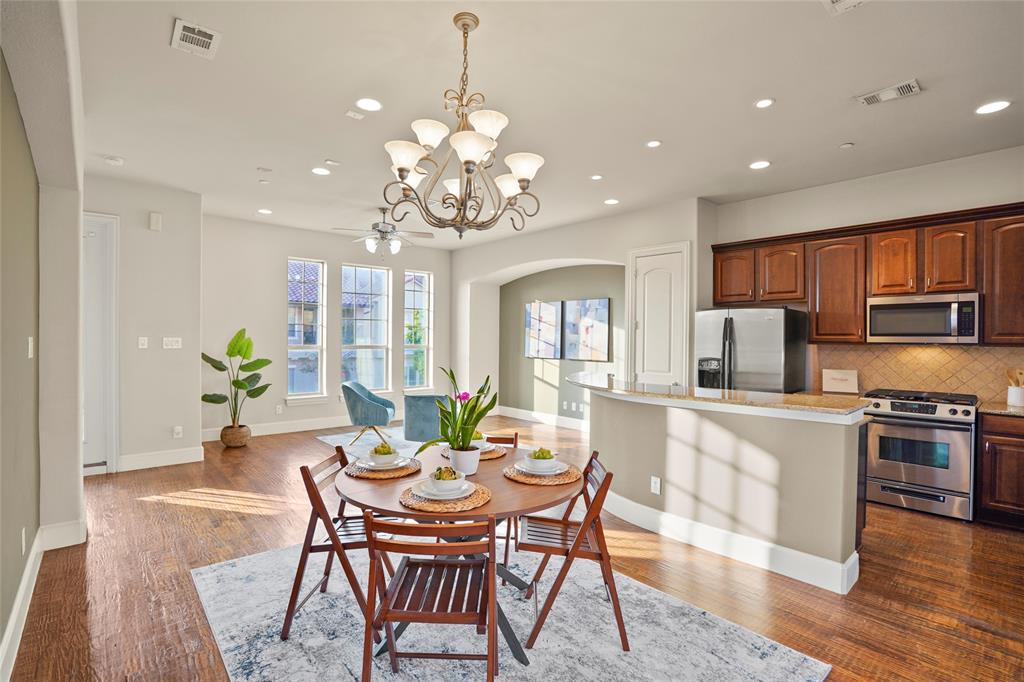 6748 Plaza Via Irving, TX 75039 - Photo 7 of 31 a view of a dining room with furniture window and wooden floor
