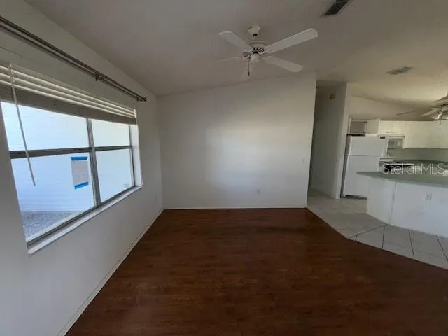 a view of a kitchen with a sink and dishwasher