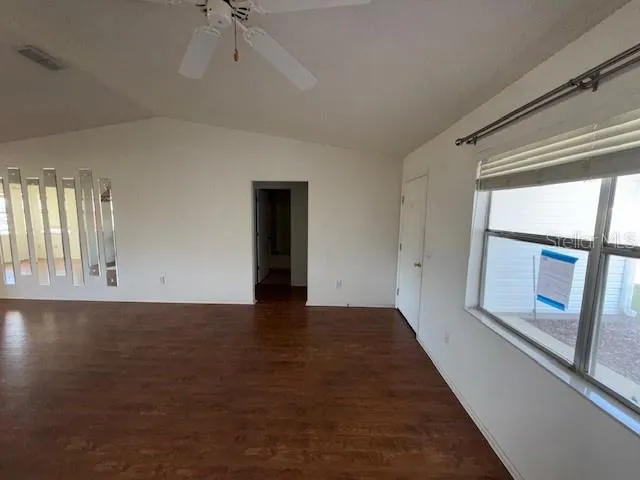 a view of an empty room with a window