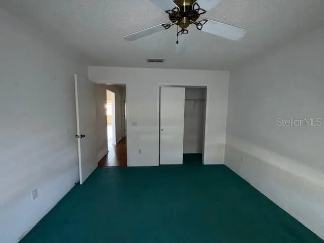 a view of an empty room with a bathroom