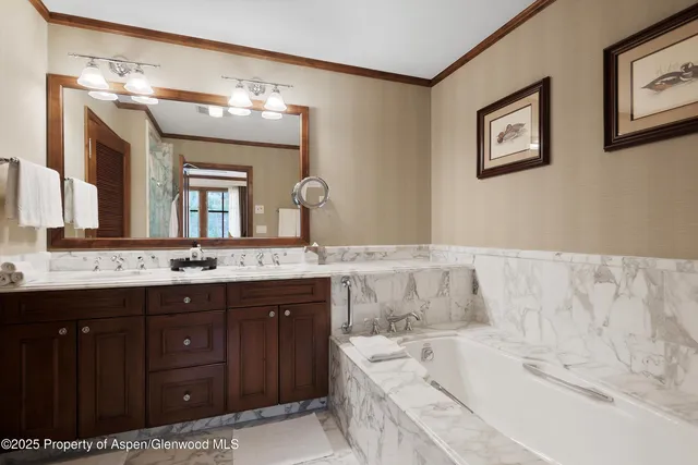 a spacious bathroom with a granite countertop tub sink and mirror