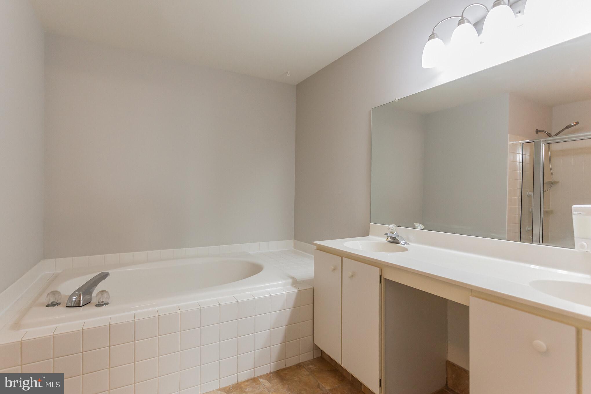 1908 Sterling Road, Unit 7 Yardley, PA 19067 - Photo 25 of 30 Double sinks and soaking tub in master bath