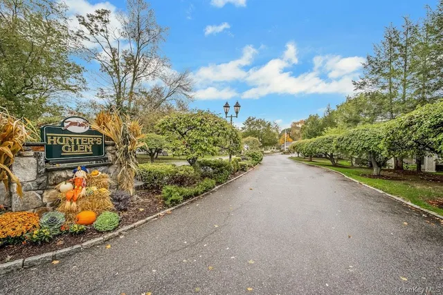 a view of a street with sign board