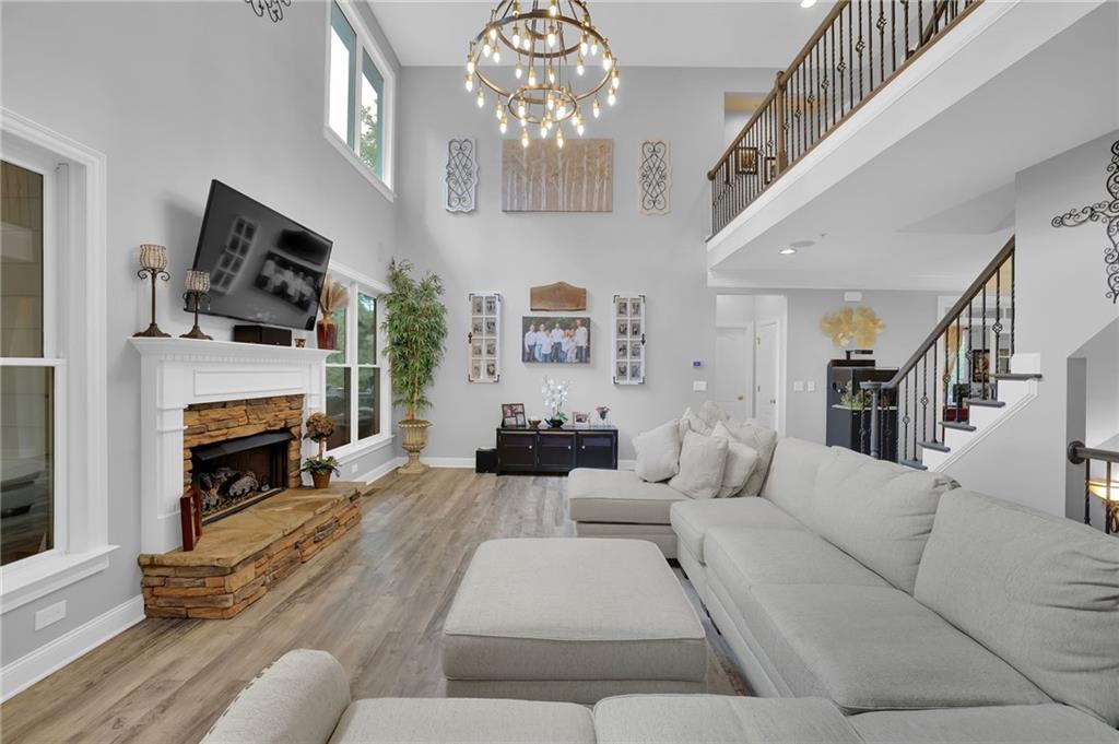 6010 Anchorage Quay Cumming, GA 30041 - Photo 16 of 72 a living room with furniture fireplace and flat screen tv