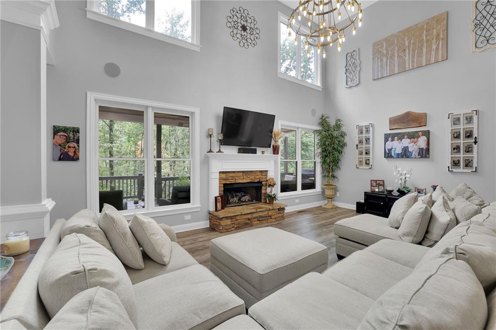 6010 Anchorage Quay Cumming, GA 30041 - Photo 17 of 72 a living room with furniture a fireplace and a flat screen tv
