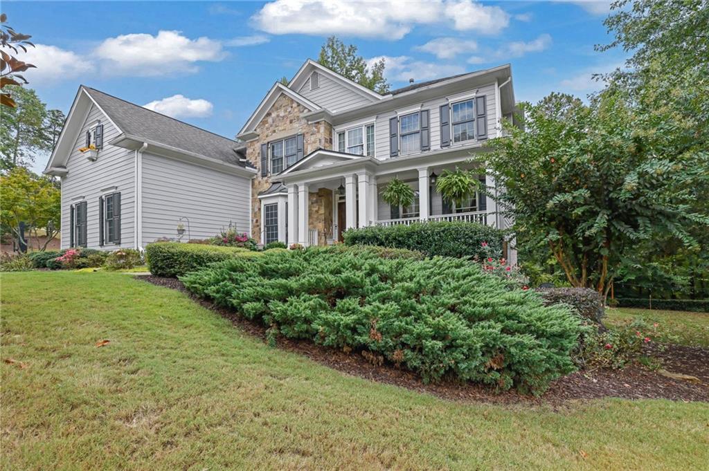 6010 Anchorage Quay Cumming, GA 30041 - Photo 2 of 72 a front view of a house with a yard