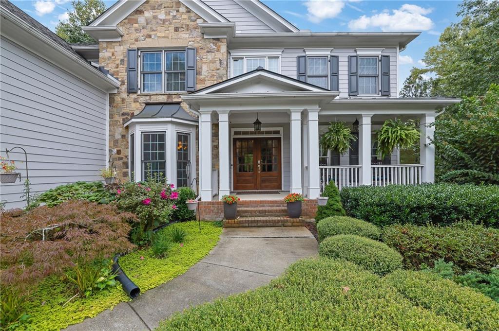 6010 Anchorage Quay Cumming, GA 30041 - Photo 3 of 72 a front view of a house with garden