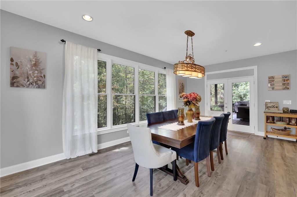 6010 Anchorage Quay Cumming, GA 30041 - Photo 31 of 72 a dining room with furniture window wooden floor