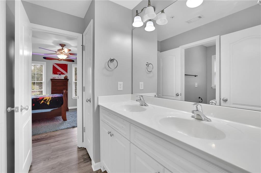 6010 Anchorage Quay Cumming, GA 30041 - Photo 43 of 72 a en suite bathroom with a sink double vanity and a mirror