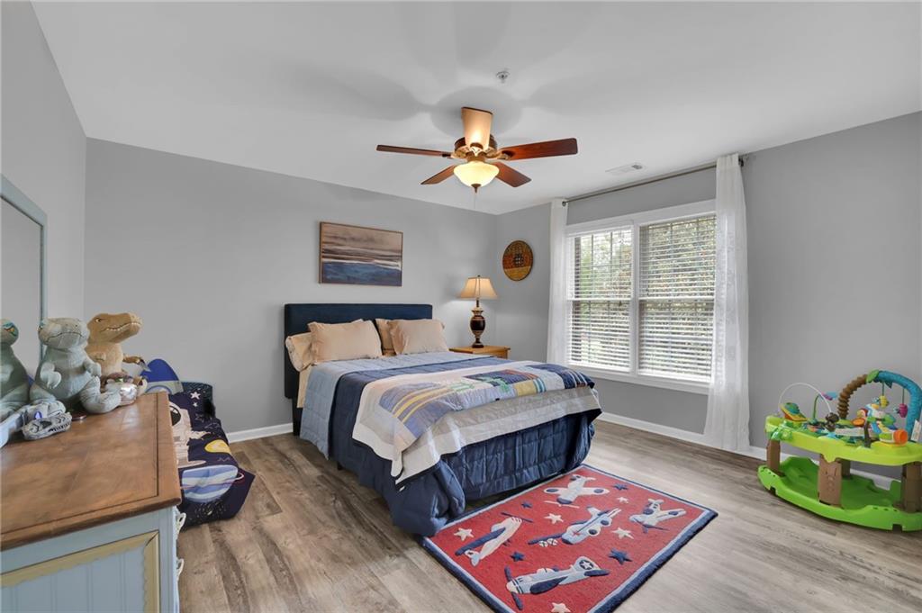 6010 Anchorage Quay Cumming, GA 30041 - Photo 45 of 72 a bedroom with bed and a window