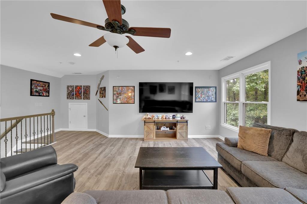 6010 Anchorage Quay Cumming, GA 30041 - Photo 49 of 72 a living room with furniture and a flat screen tv