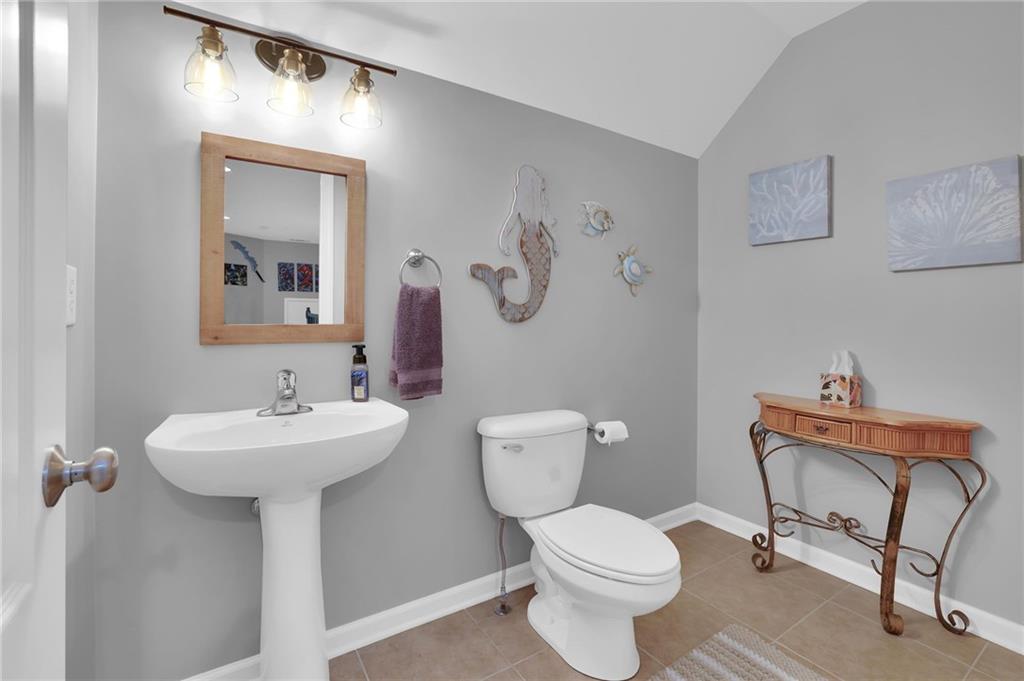 6010 Anchorage Quay Cumming, GA 30041 - Photo 50 of 72 a bathroom with a toilet sink and mirror