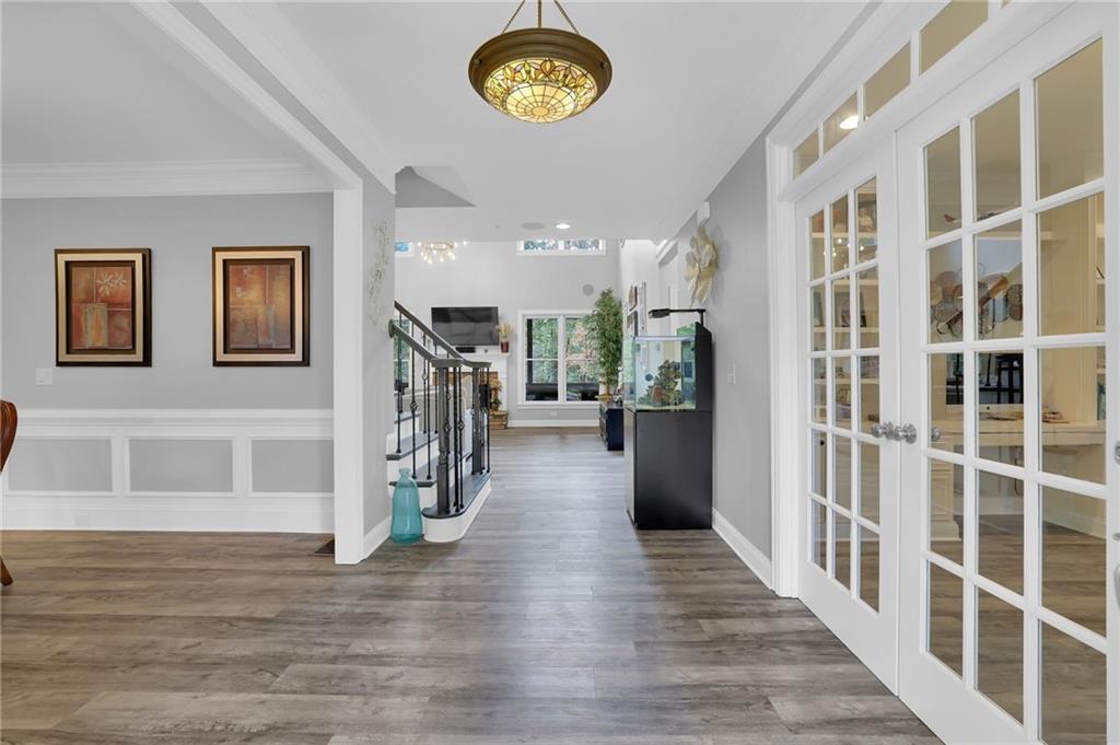 6010 Anchorage Quay Cumming, GA 30041 - Photo 5 of 72 a view of a hallway with wooden floor and entryway