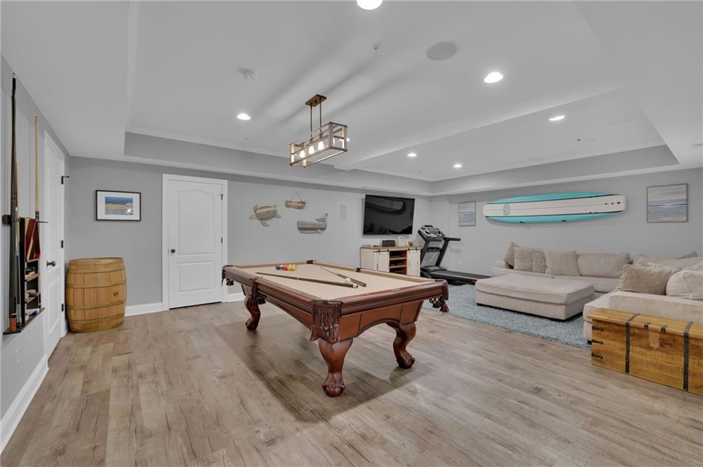 6010 Anchorage Quay Cumming, GA 30041 - Photo 58 of 72 a living room with furniture and wooden floor