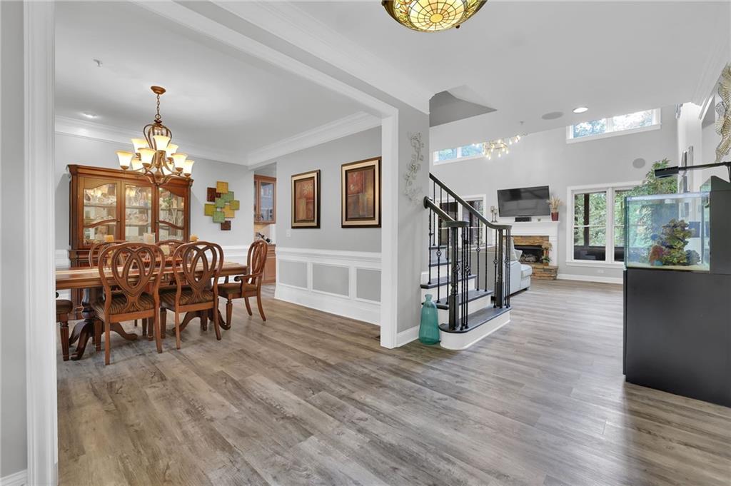 6010 Anchorage Quay Cumming, GA 30041 - Photo 7 of 72 a dining room with furniture entryway and wooden floor