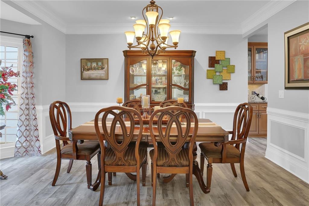 6010 Anchorage Quay Cumming, GA 30041 - Photo 9 of 72 a view of a dining room with furniture window and wooden floor