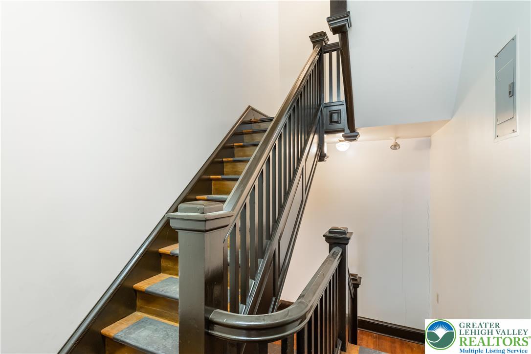384 Evansville Road Fleetwood, PA 19522 - Photo 28 of 54 a view of staircase with wooden floor and metal railing