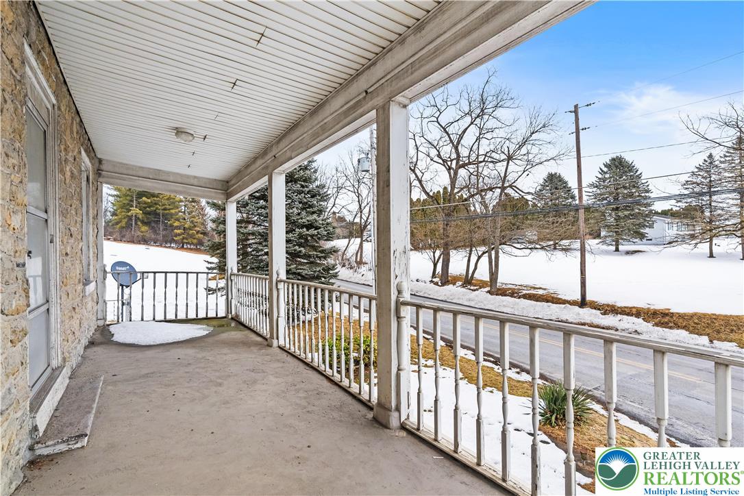 384 Evansville Road Fleetwood, PA 19522 - Photo 4 of 54 a view of a porch with wooden floor and fence
