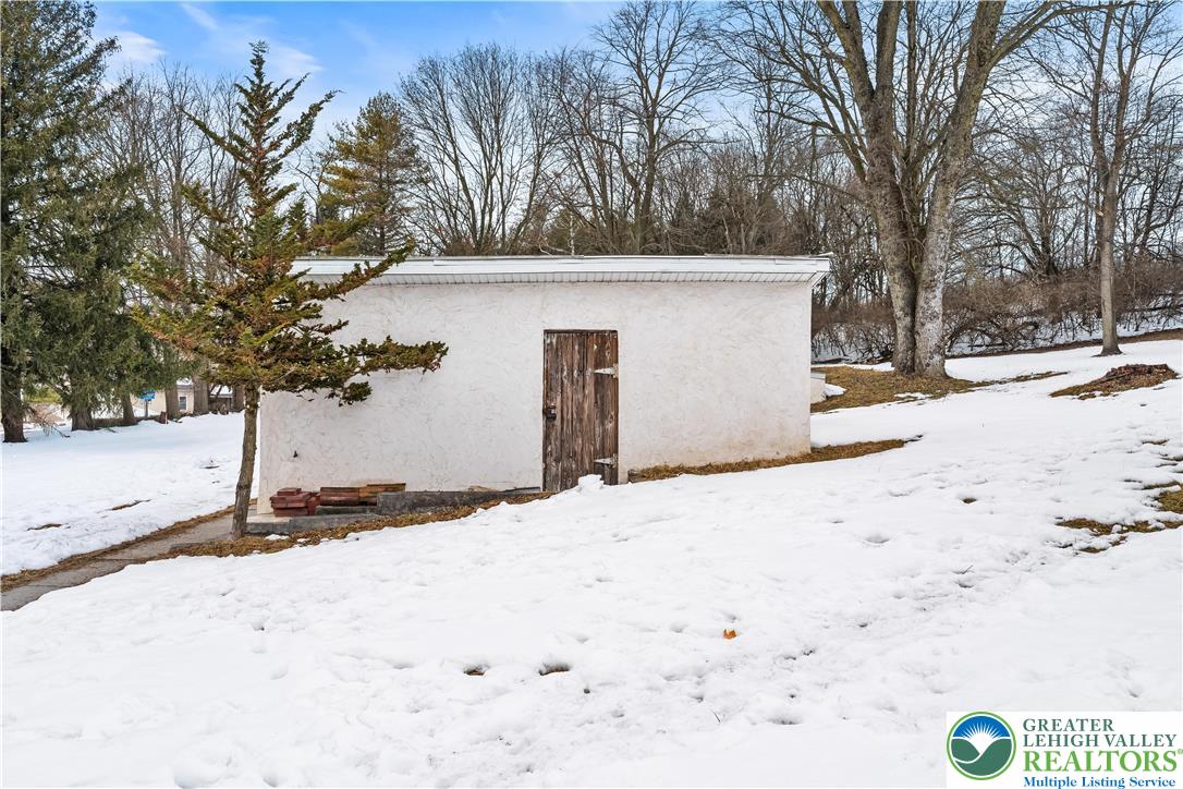 384 Evansville Road Fleetwood, PA 19522 - Photo 48 of 54 a view of a white house with a snow on the road