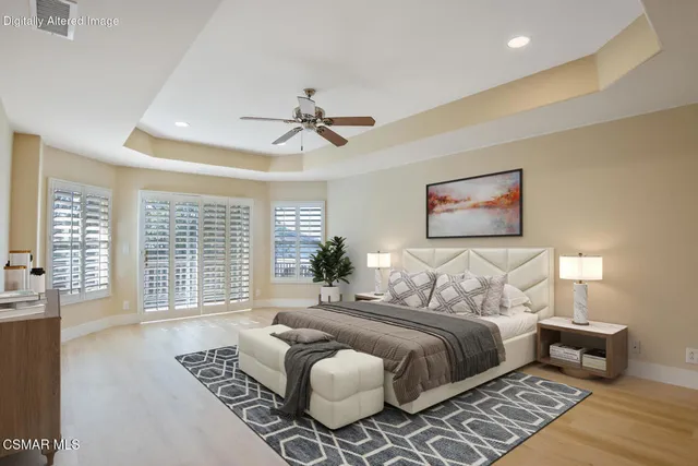 a bedroom with bed and wooden floor