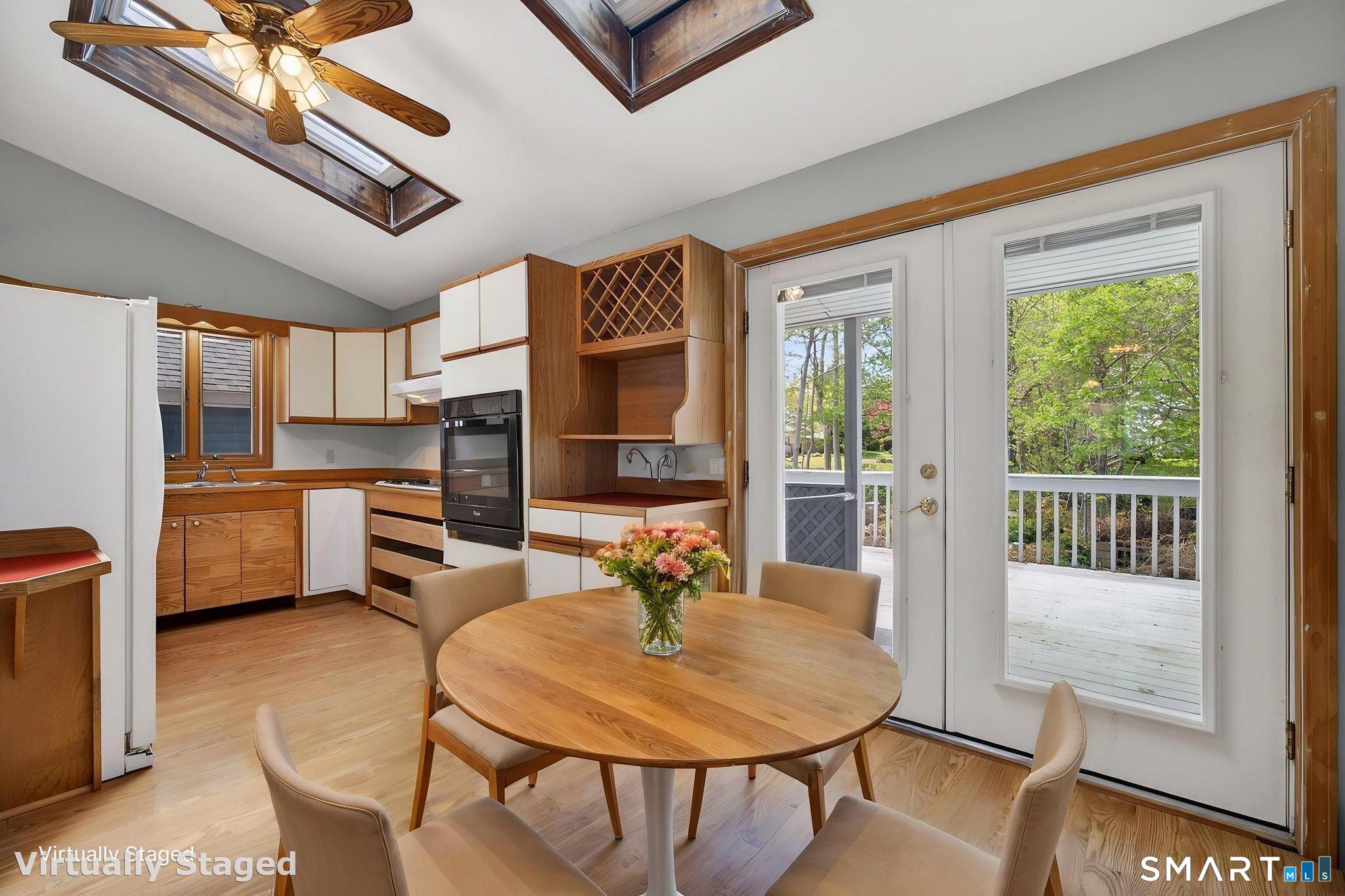 19 High Street Groton, CT 06340 - Photo 13 of 38 a dining room with furniture and a kitchen view