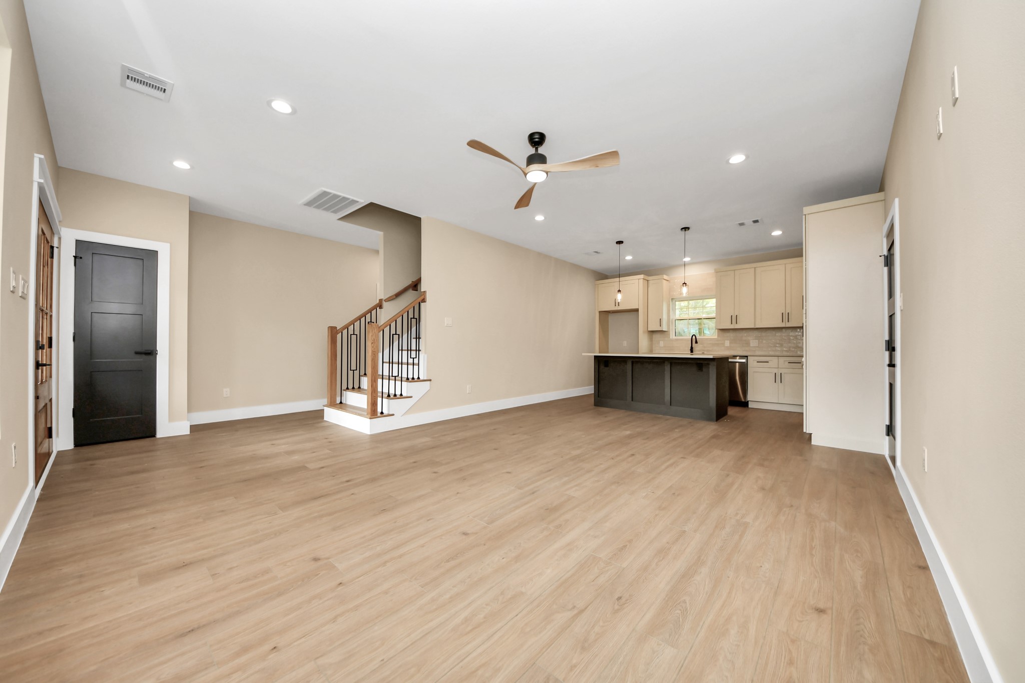 29727 Spring Forest Drive Spring, TX 77386 - Photo 11 of 37 a view of a kitchen with furniture and a ceiling fan