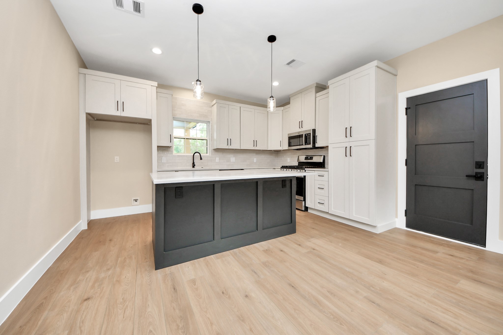 29727 Spring Forest Drive Spring, TX 77386 - Photo 13 of 37 a kitchen with kitchen island a sink stainless steel appliances and cabinets