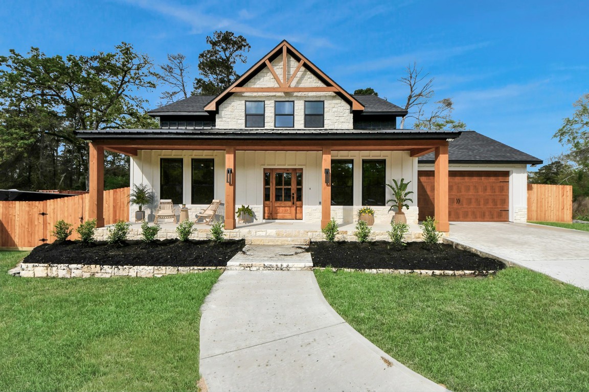29727 Spring Forest Drive Spring, TX 77386 - Photo 2 of 37 a front view of a house with a yard