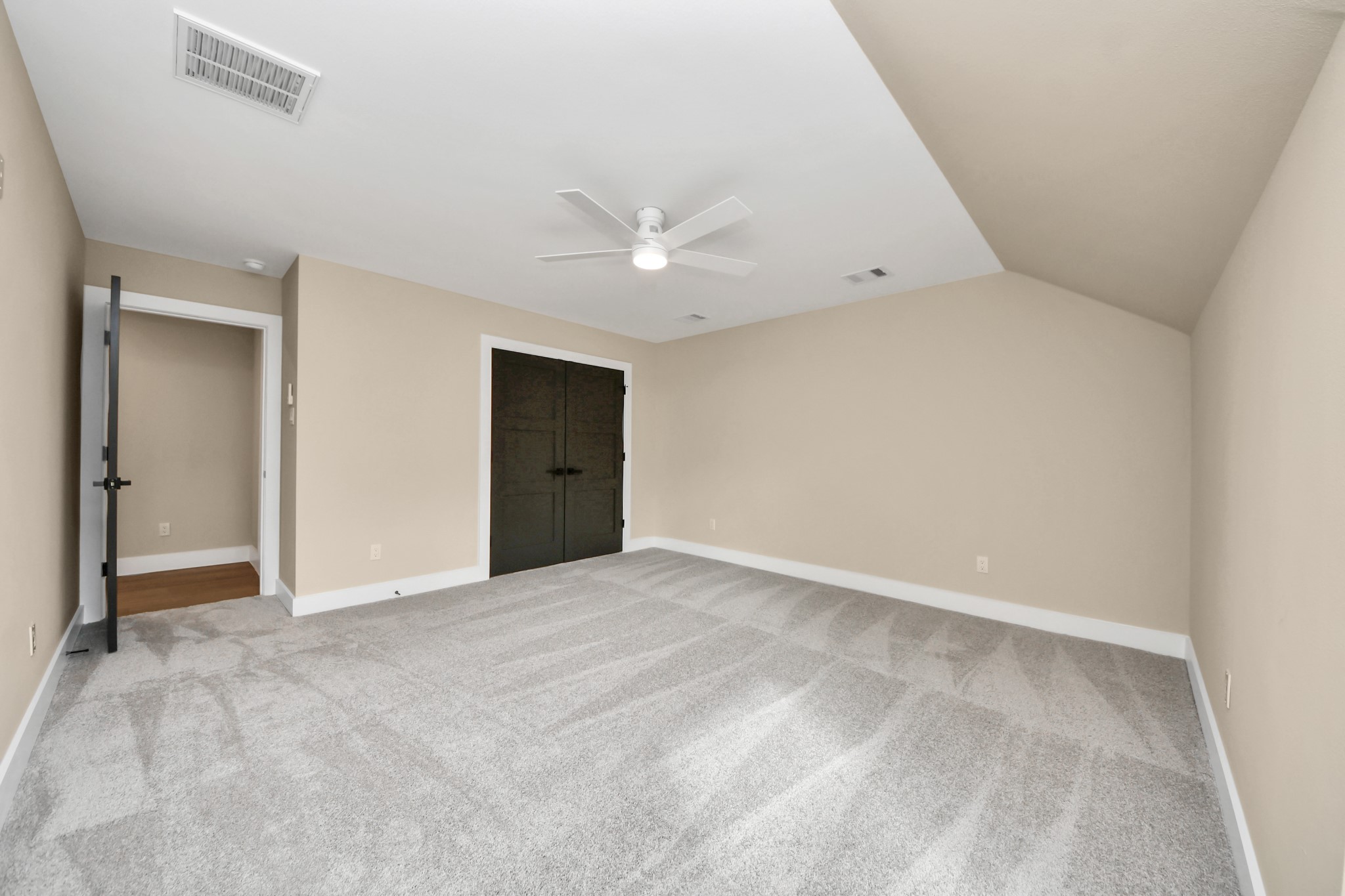 29727 Spring Forest Drive Spring, TX 77386 - Photo 25 of 37 a view of an empty room with a ceiling fan
