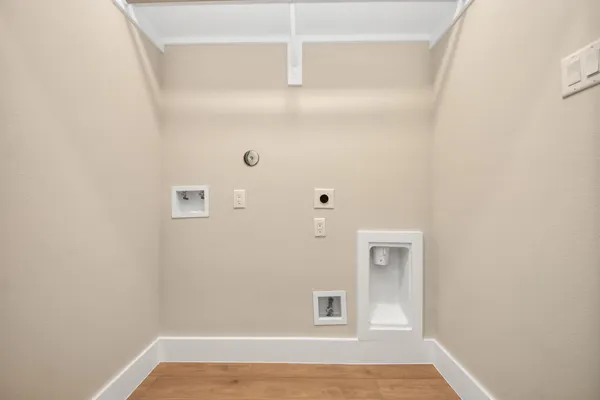 a view of a small space with wooden floor