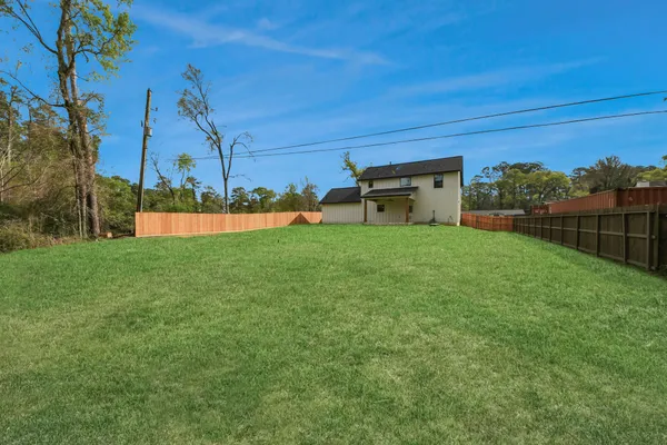 a view of a backyard with sitting area