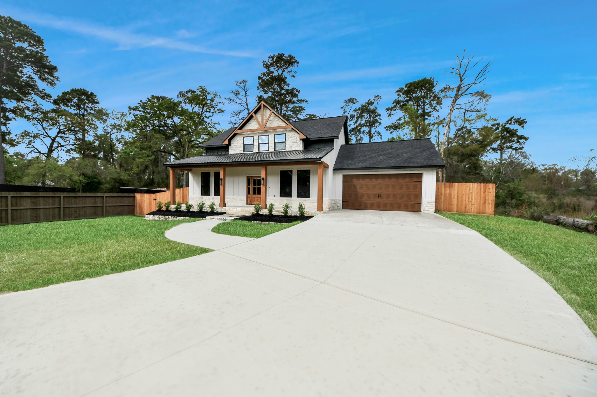 29727 Spring Forest Drive Spring, TX 77386 - Photo 4 of 37 a view of house with garden and tall tress