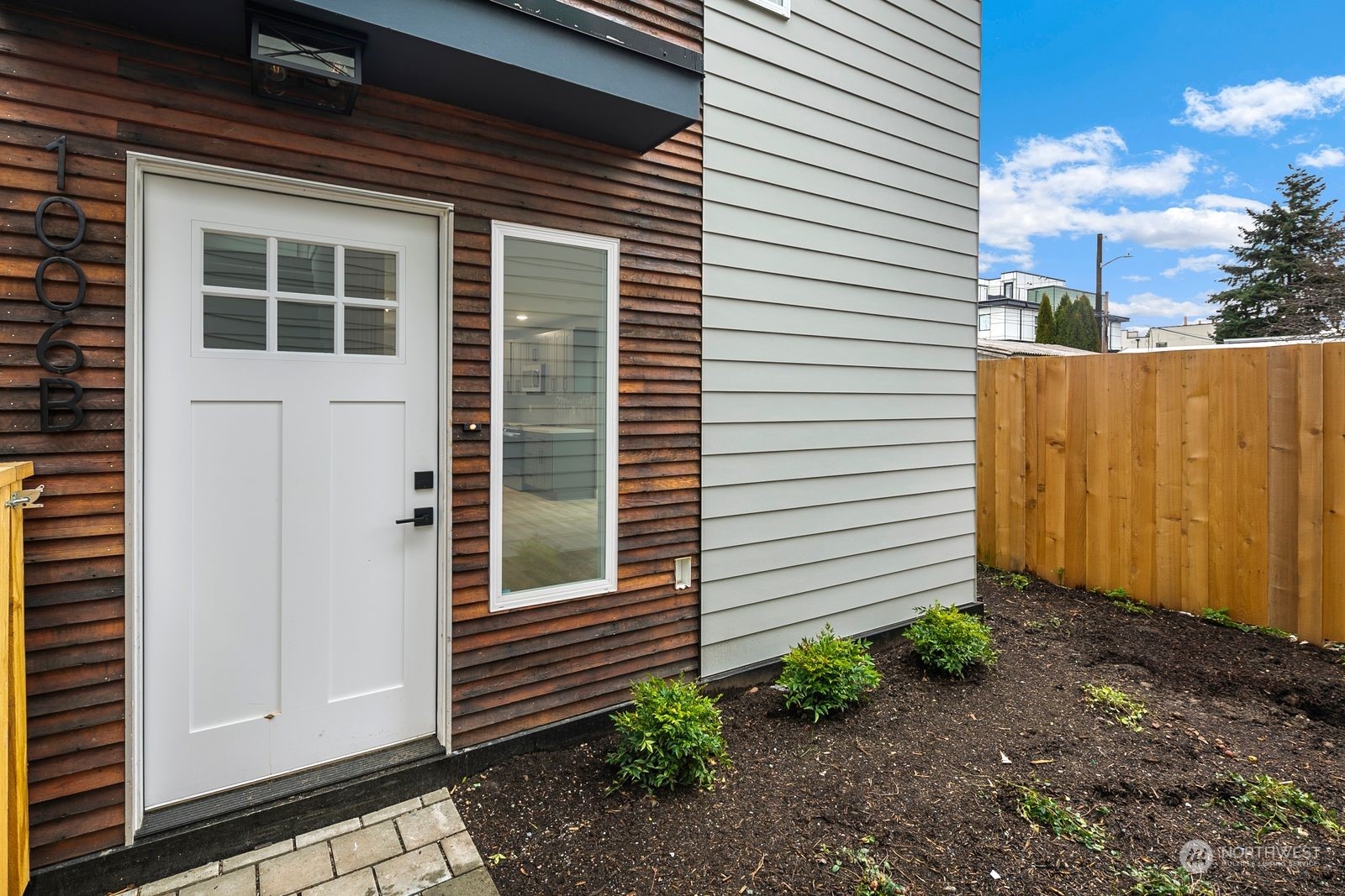 1006 B South Donovan Street Seattle, WA 98108 - Photo 2 of 14 a view of a house with backyard and plants