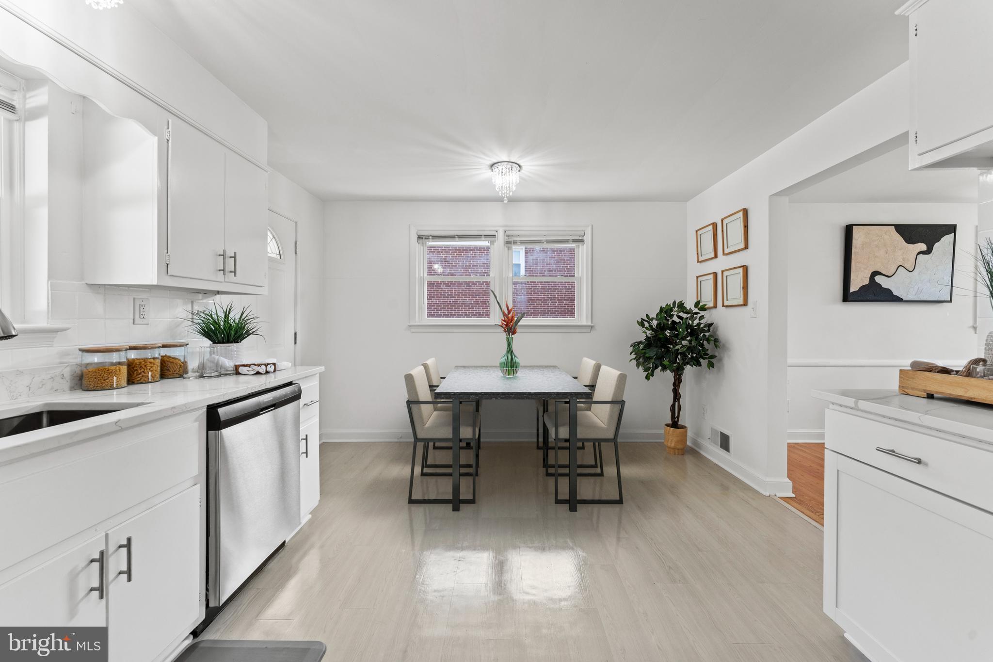 11006 Childs Street Silver Spring, MD 20901 - Photo 13 of 71 a kitchen with a table and chairs in it