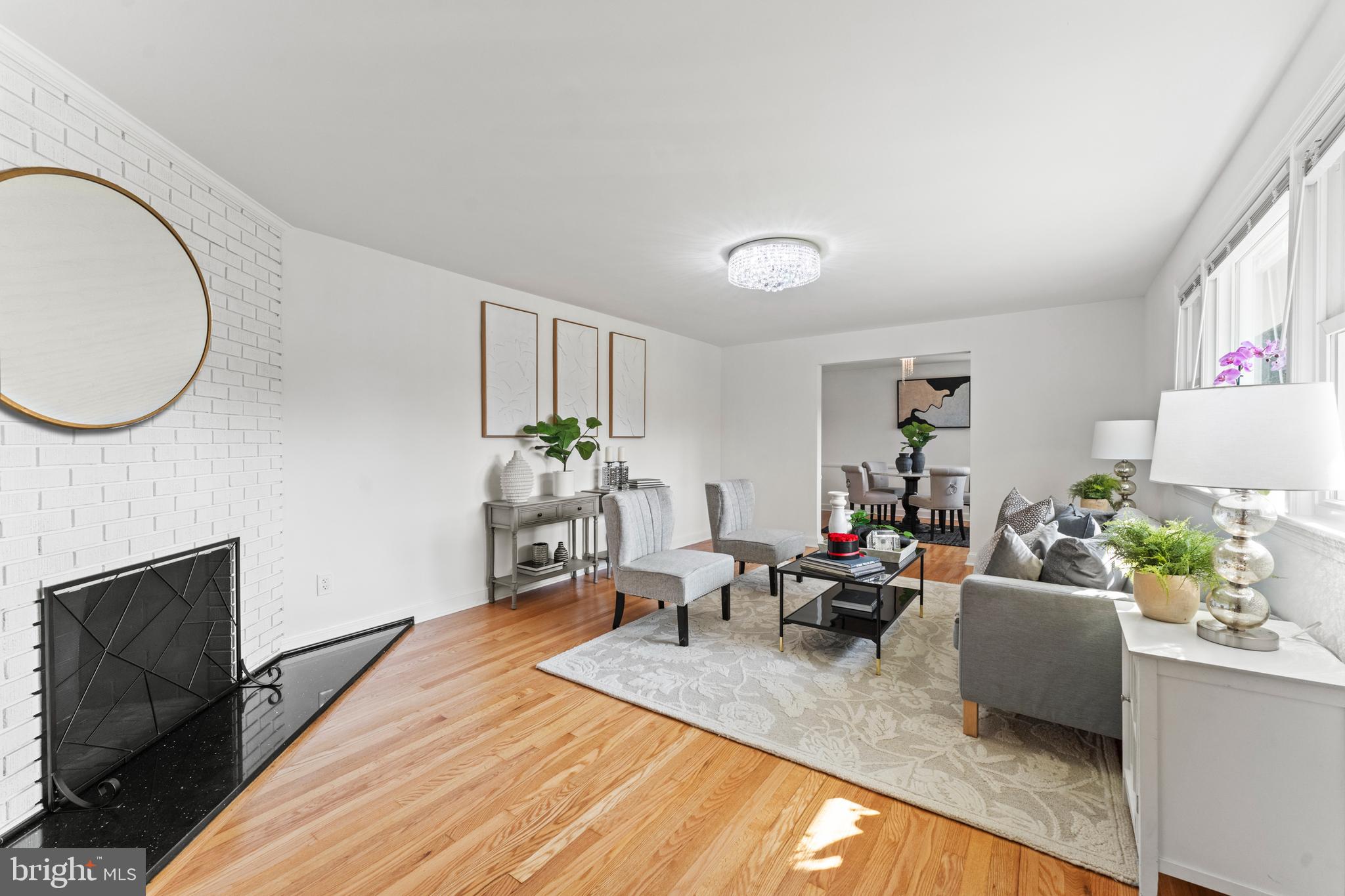 11006 Childs Street Silver Spring, MD 20901 - Photo 4 of 71 a living room with furniture a fireplace and a potted plant