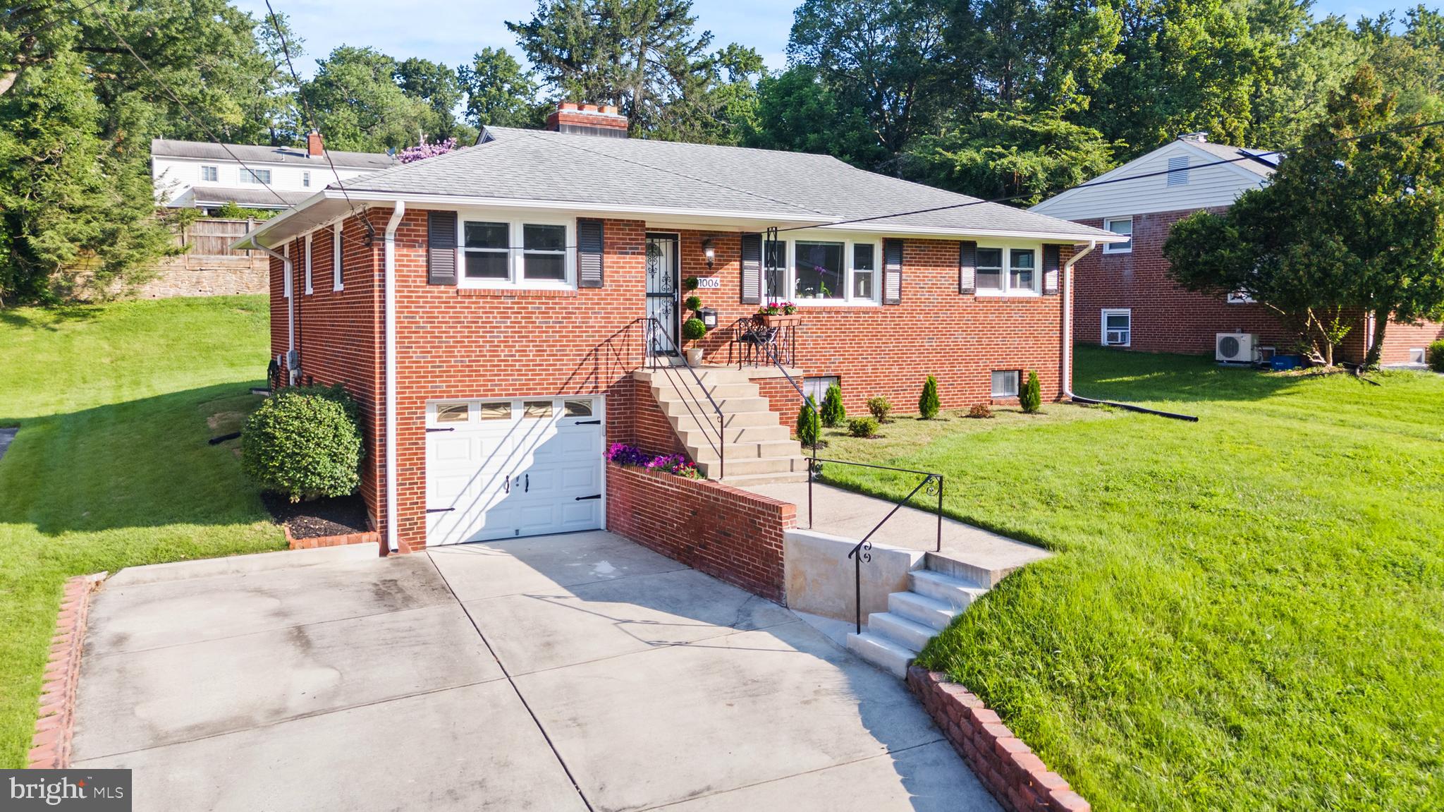 11006 Childs Street Silver Spring, MD 20901 - Photo 66 of 71 a front view of a house with a yard table and chairs