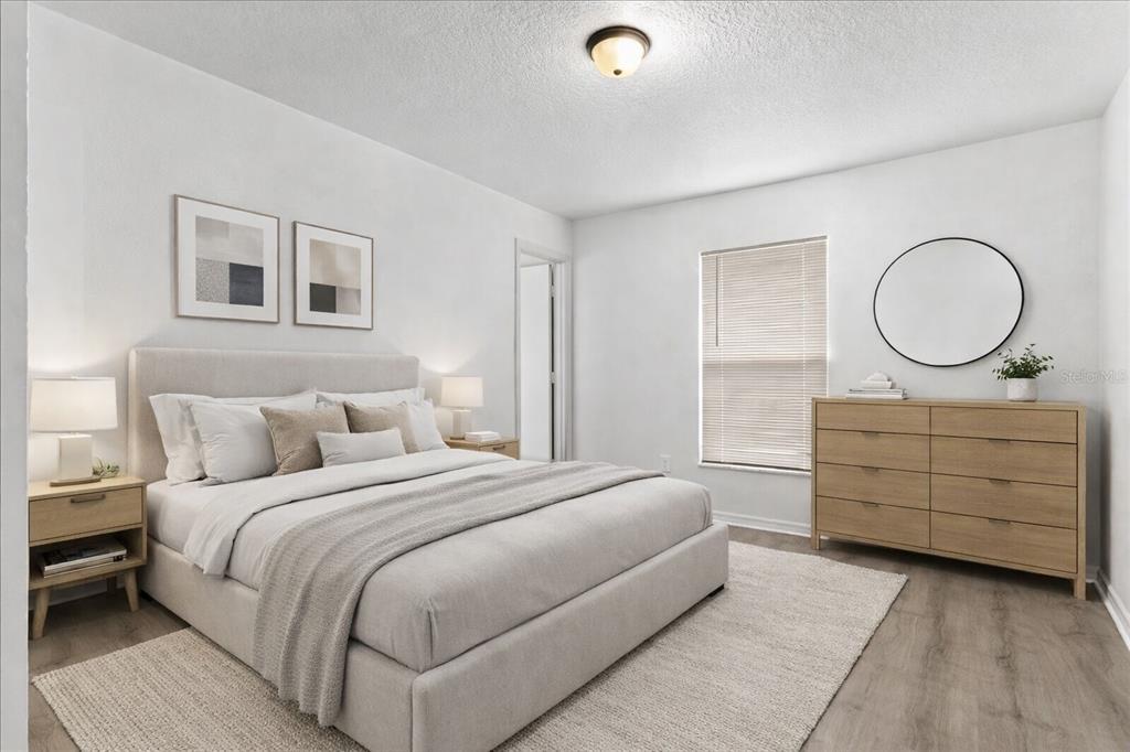 3417 Temple Street, Unit A Tampa, FL 33619 - Photo 11 of 30 a bedroom with a bed and closet