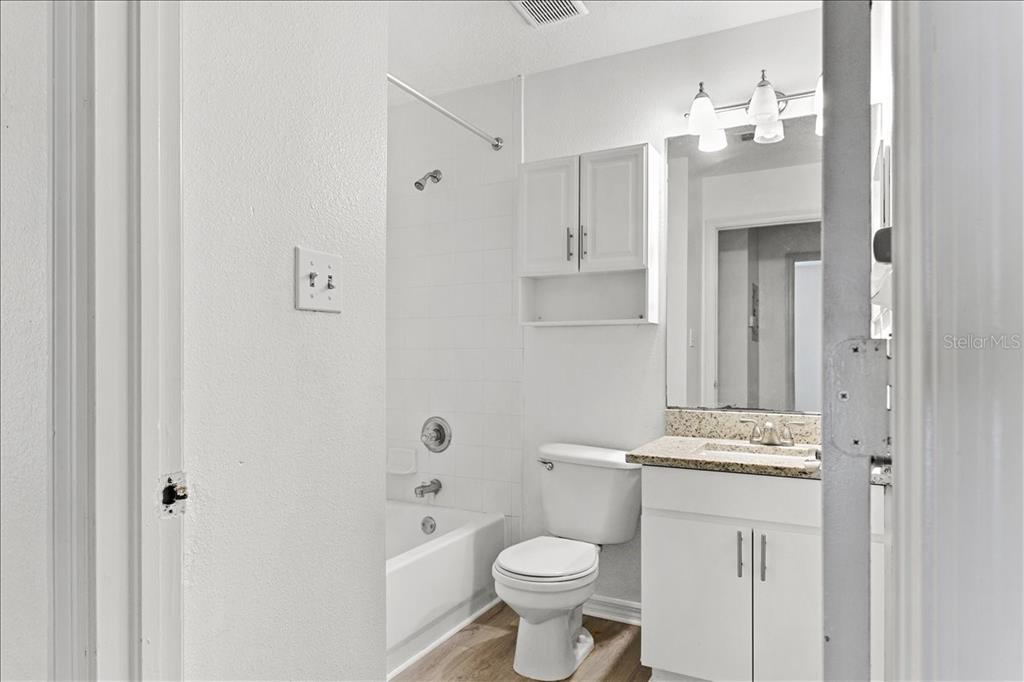 3417 Temple Street, Unit A Tampa, FL 33619 - Photo 16 of 30 a bathroom with a sink a toilet and shower