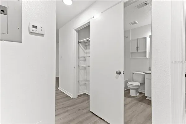 a bedroom with a bed and a desk