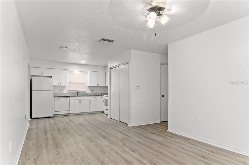 3417 Temple Street, Unit A Tampa, FL 33619 - Photo 2 of 30 a kitchen with a refrigerator and a stove top oven