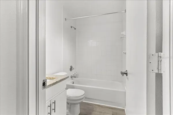 a bedroom with a bed and a table in it