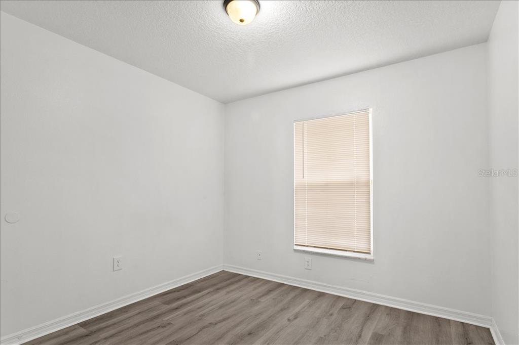 3417 Temple Street, Unit A Tampa, FL 33619 - Photo 25 of 30 an empty room with a window