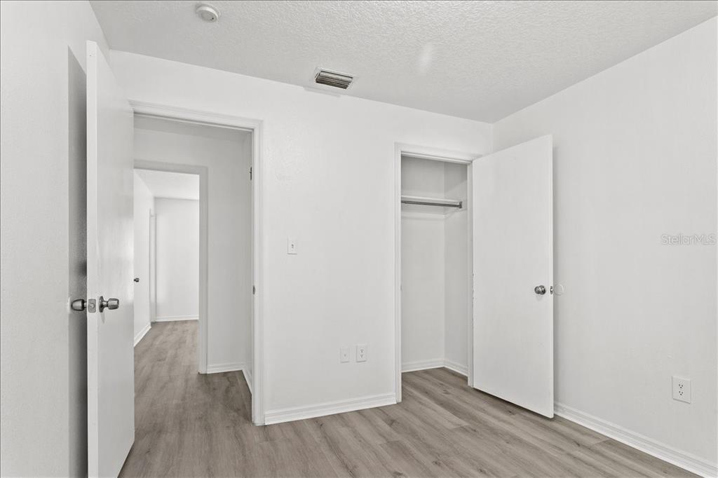 3417 Temple Street, Unit A Tampa, FL 33619 - Photo 27 of 30 a view of a hallway with wooden floor