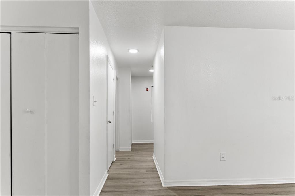 3417 Temple Street, Unit A Tampa, FL 33619 - Photo 29 of 30 a view of a hallway with wooden floor
