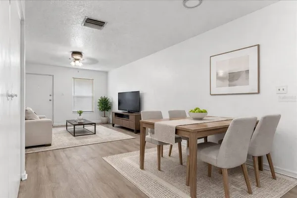 a view of a livingroom with furniture and a flat screen tv