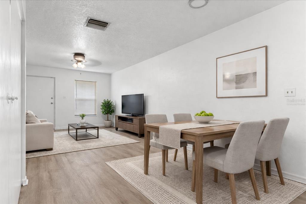 3417 Temple Street, Unit A Tampa, FL 33619 - Photo 7 of 30 a view of a livingroom with furniture and a flat screen tv